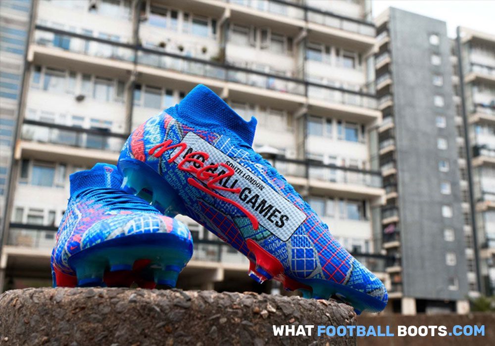 blue football boots in front of a housing block