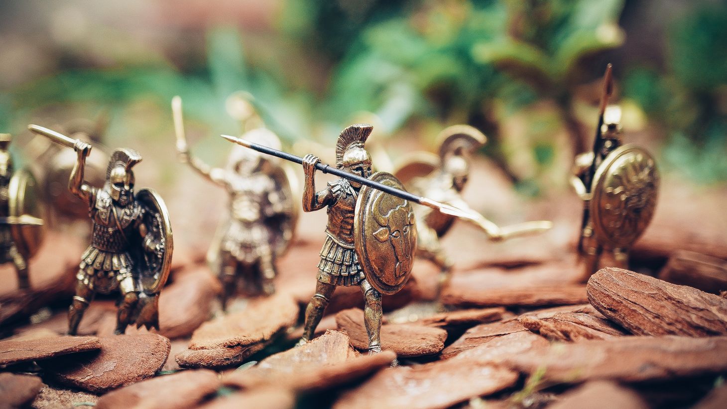 toy figures of soldiers in armour holding shields and spears
