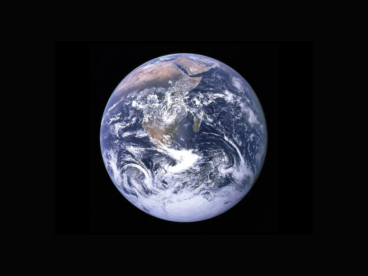 A photograph of Planet Earth against a black backdrop